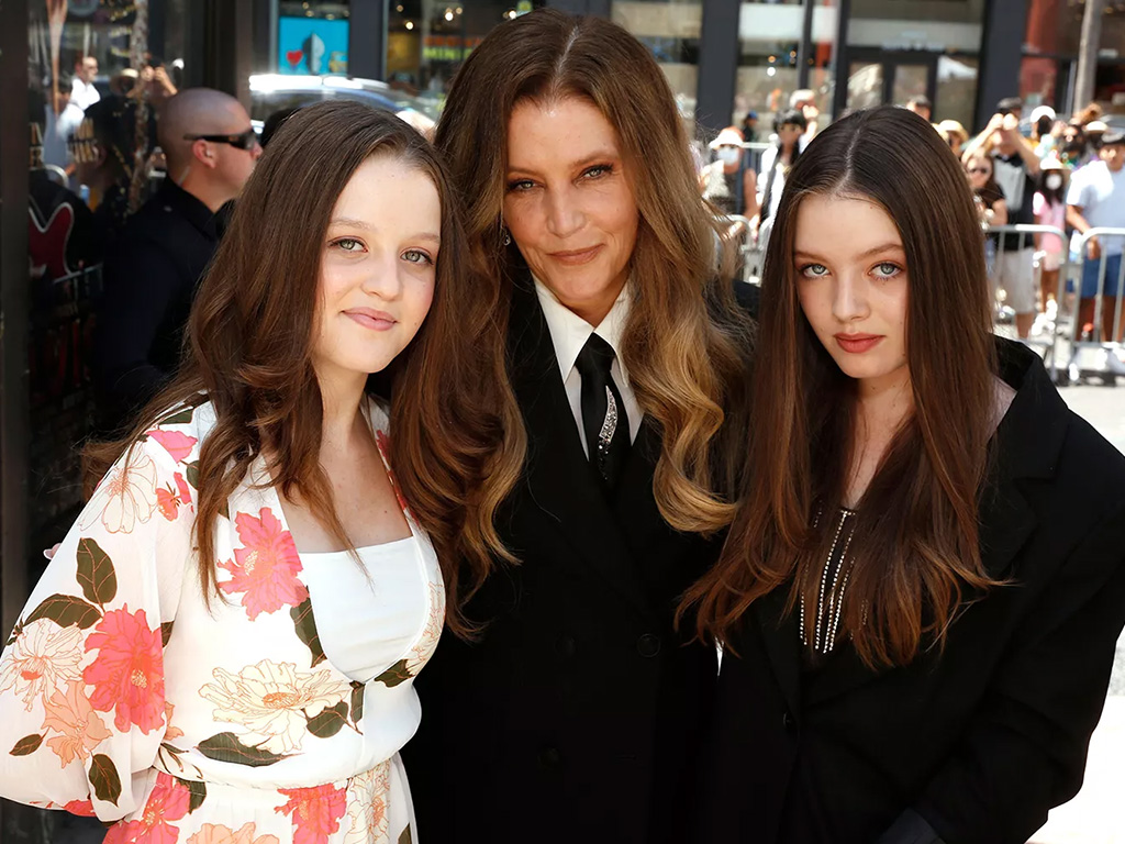 Lisa Marie Presley with her twin daughters.