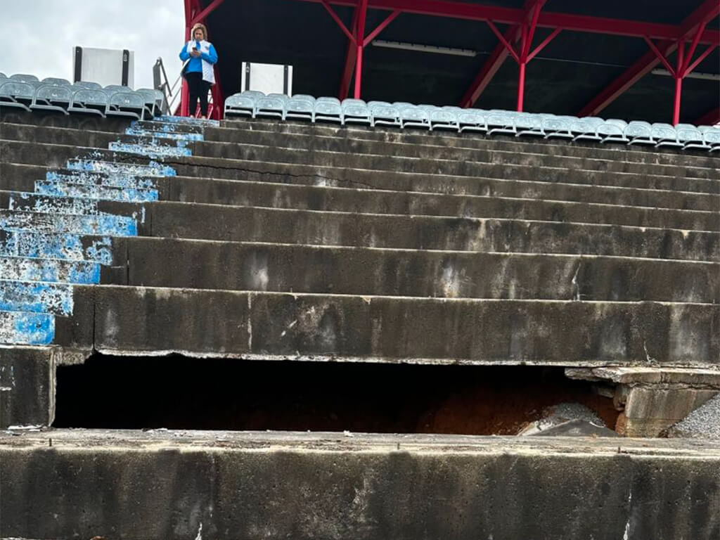 a sinkhole uncovering a rumored moonshine cave beneath a NASCAR speedway