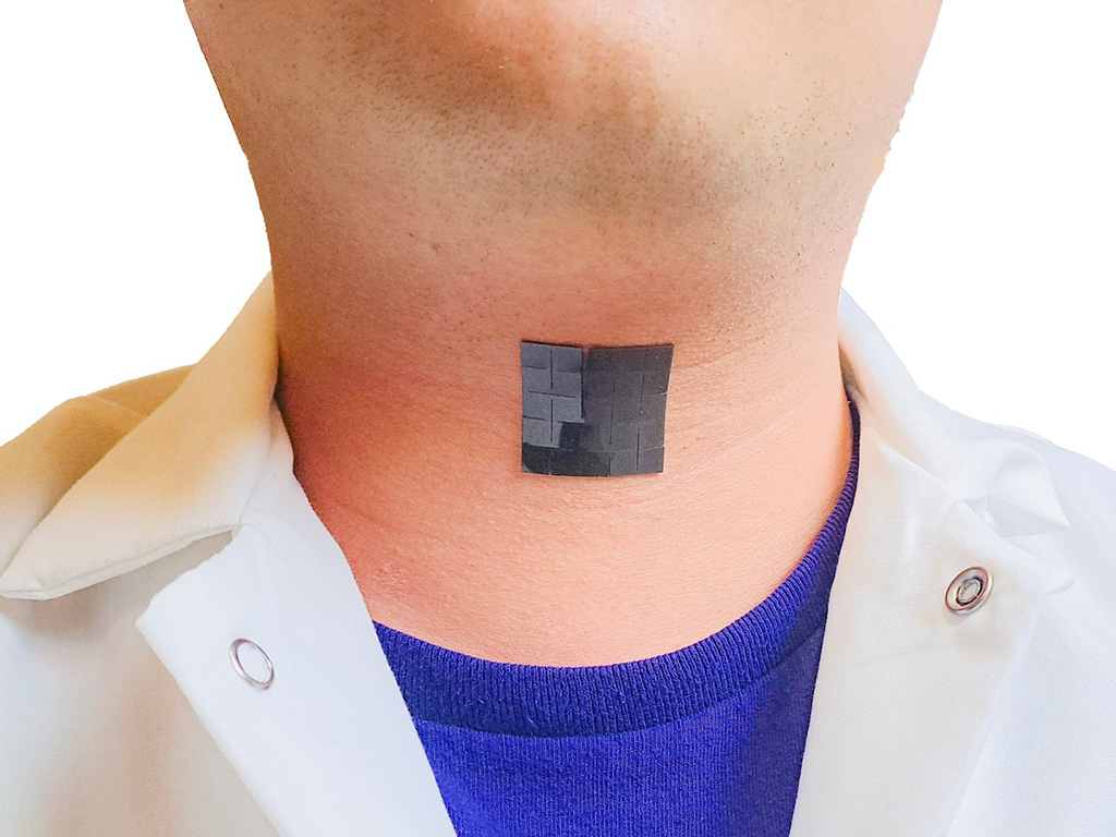 Photo of person’s neck with the device — a black adhesive square — attached outside the throat.