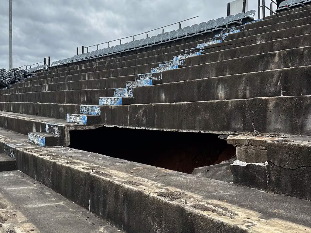 a sinkhole uncovering a rumored moonshine cave beneath a NASCAR speedway