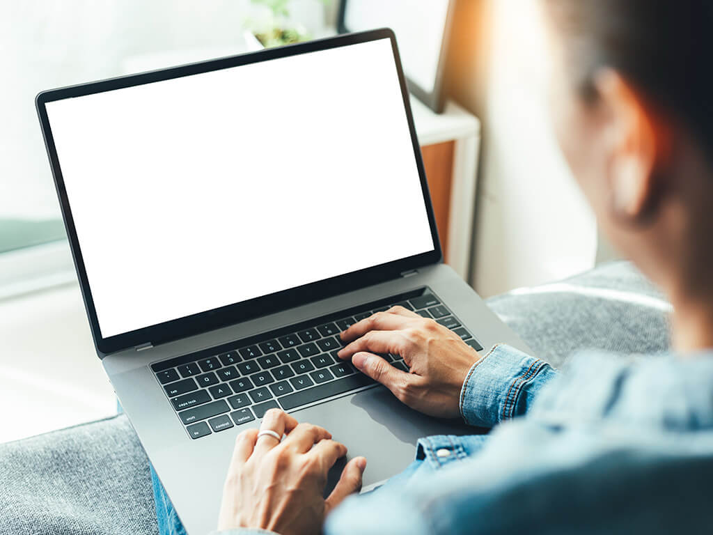 Person typing on laptop computer